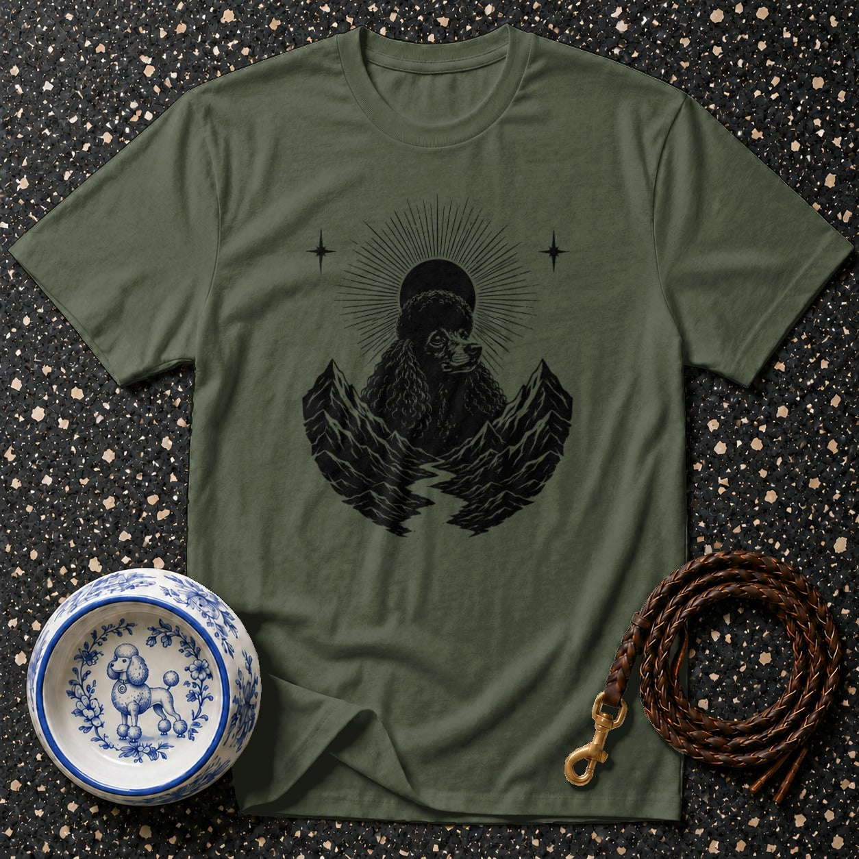 Olive green t-shirt with a black poodle design between mountains.
