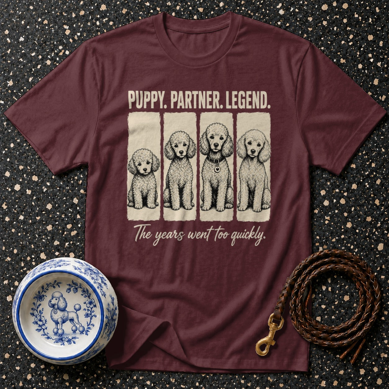 Maroon t-shirt with "PUPPY. PARTNER. LEGEND." and four poodles.