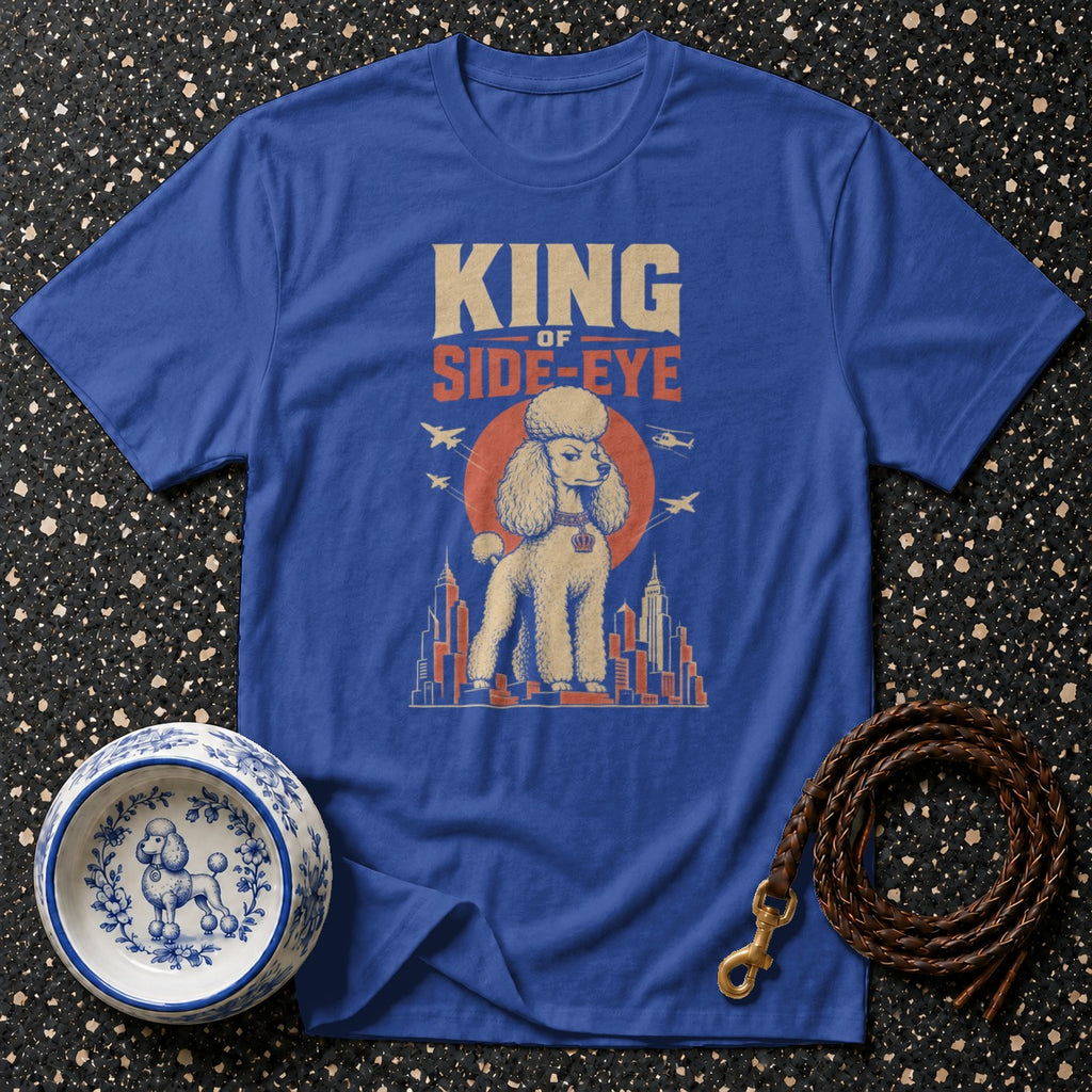 Blue t-shirt with graphic of a poodle, text "KING OF SIDE-EYE", and cityscape.