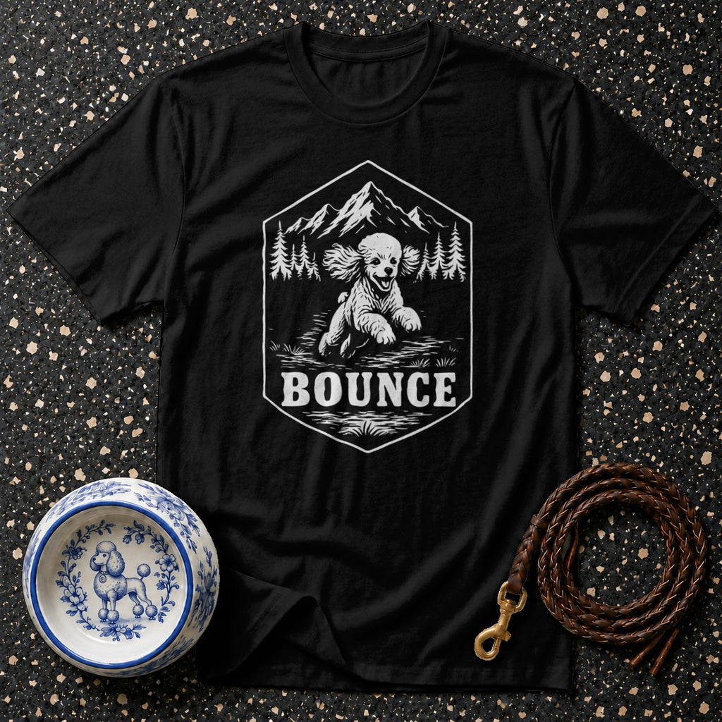 Black t-shirt with a graphic of a poodle running in nature under text "BOUNCE".
