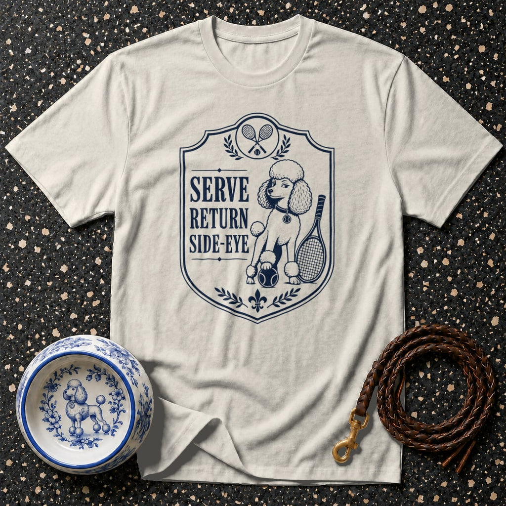 Cream t-shirt with a navy blue emblem featuring a poodle and tennis racquets.