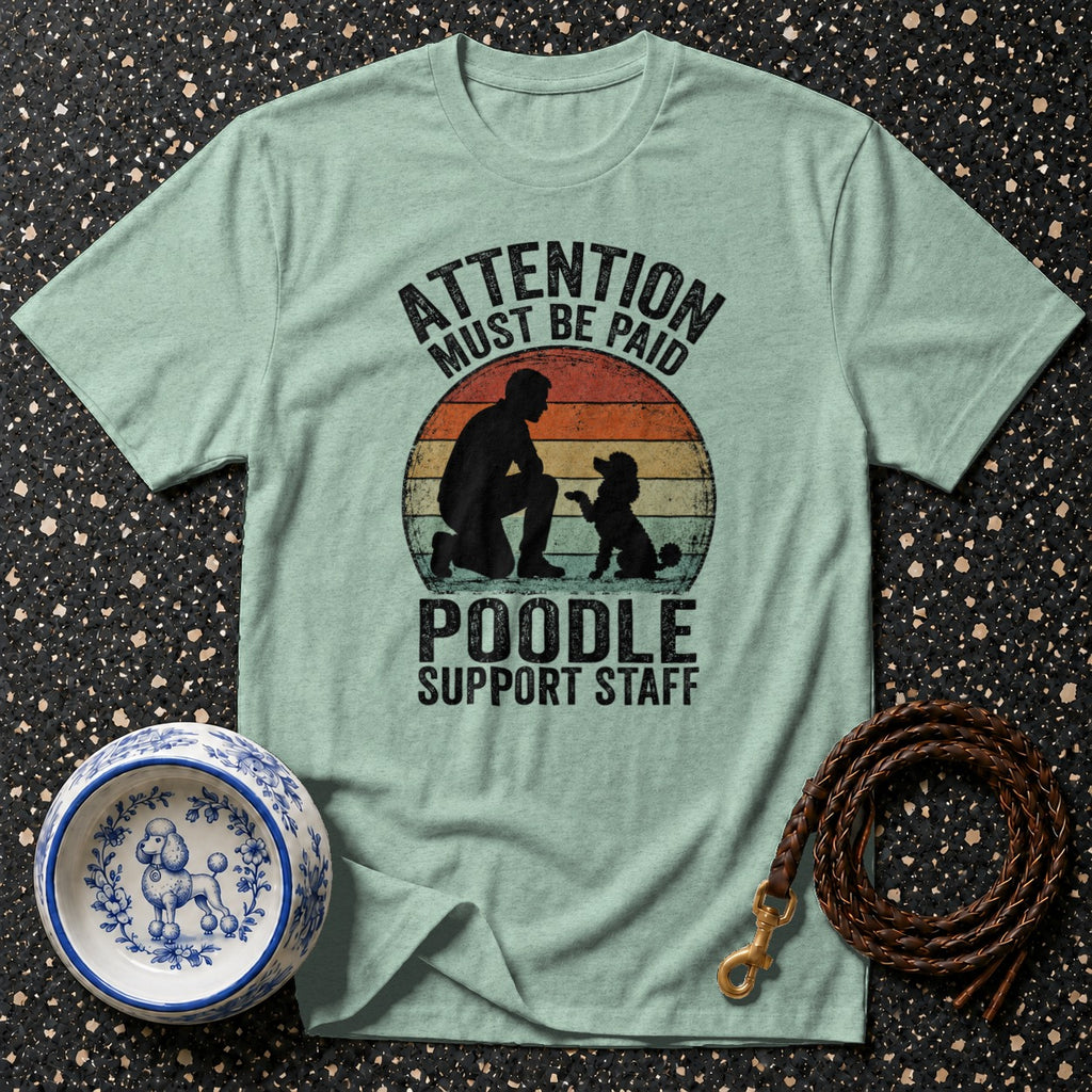 Light teal t-shirt with "ATTENTION MUST BE PAID POODLE SUPPORT STAFF" text and silhouette.