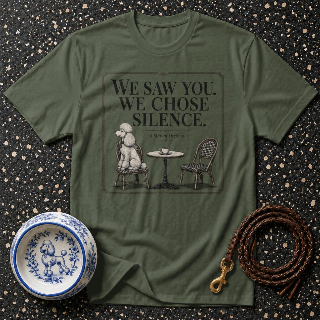 Olive green t-shirt with "We Saw You. We Chose Silence." text and poodle illustration.