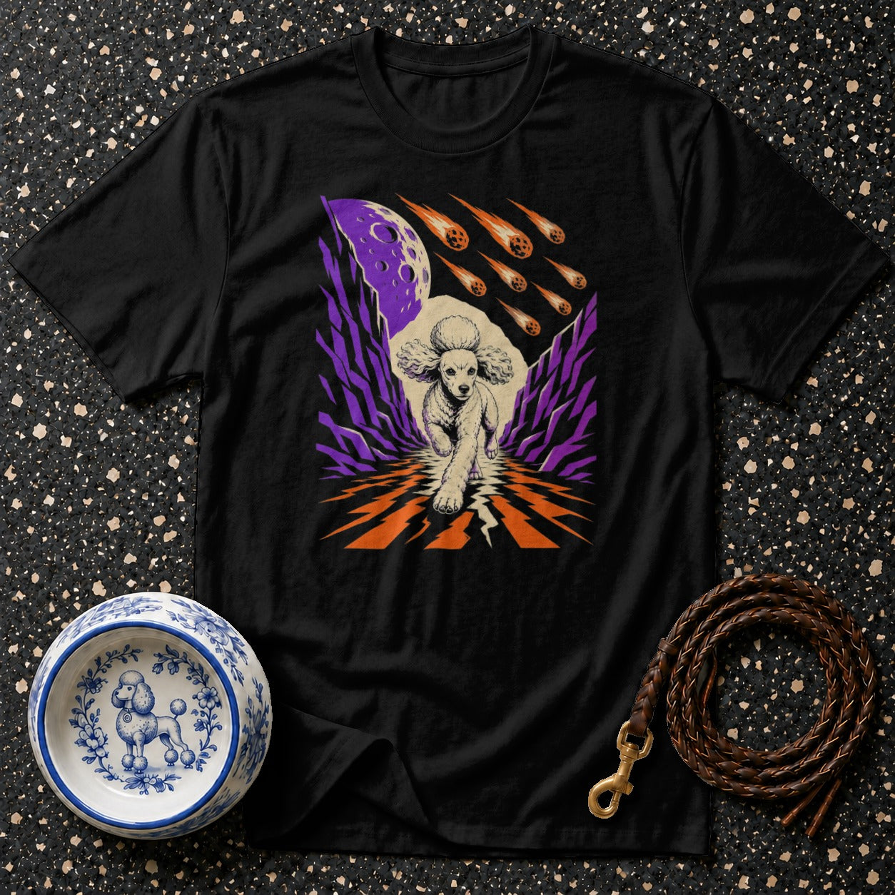 Black t-shirt with graphic of a poodle running under a purple moon and falling meteors.