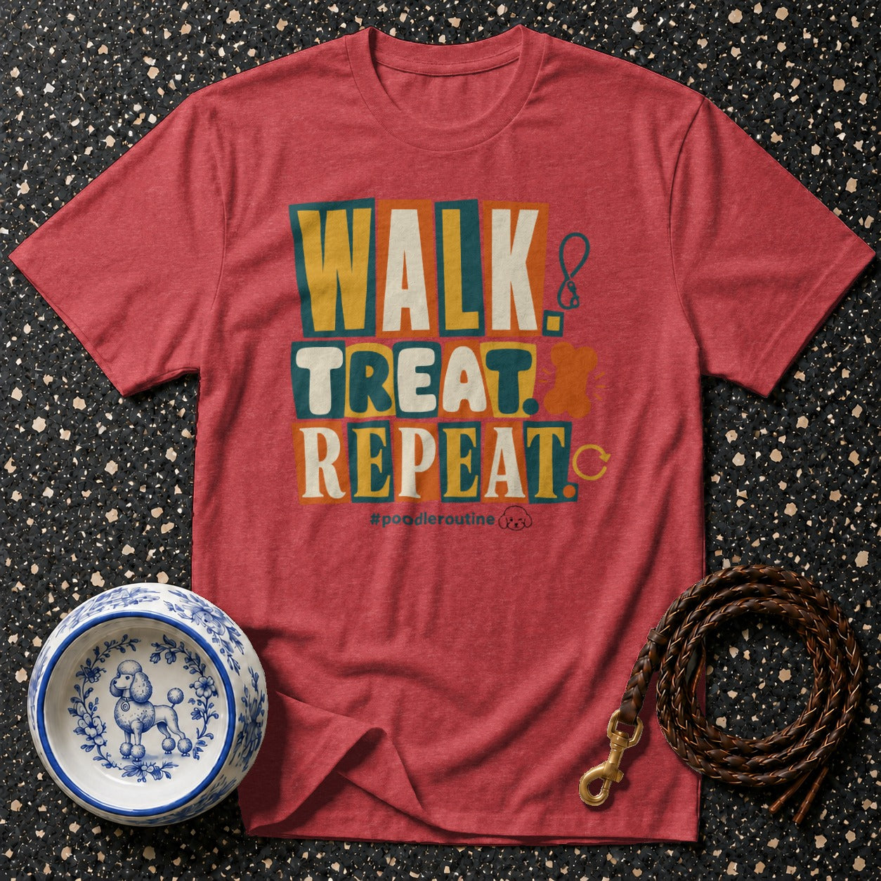 Red t-shirt with "WALK TREAT REPEAT" text, a decorative dog bowl, and a leather leash.