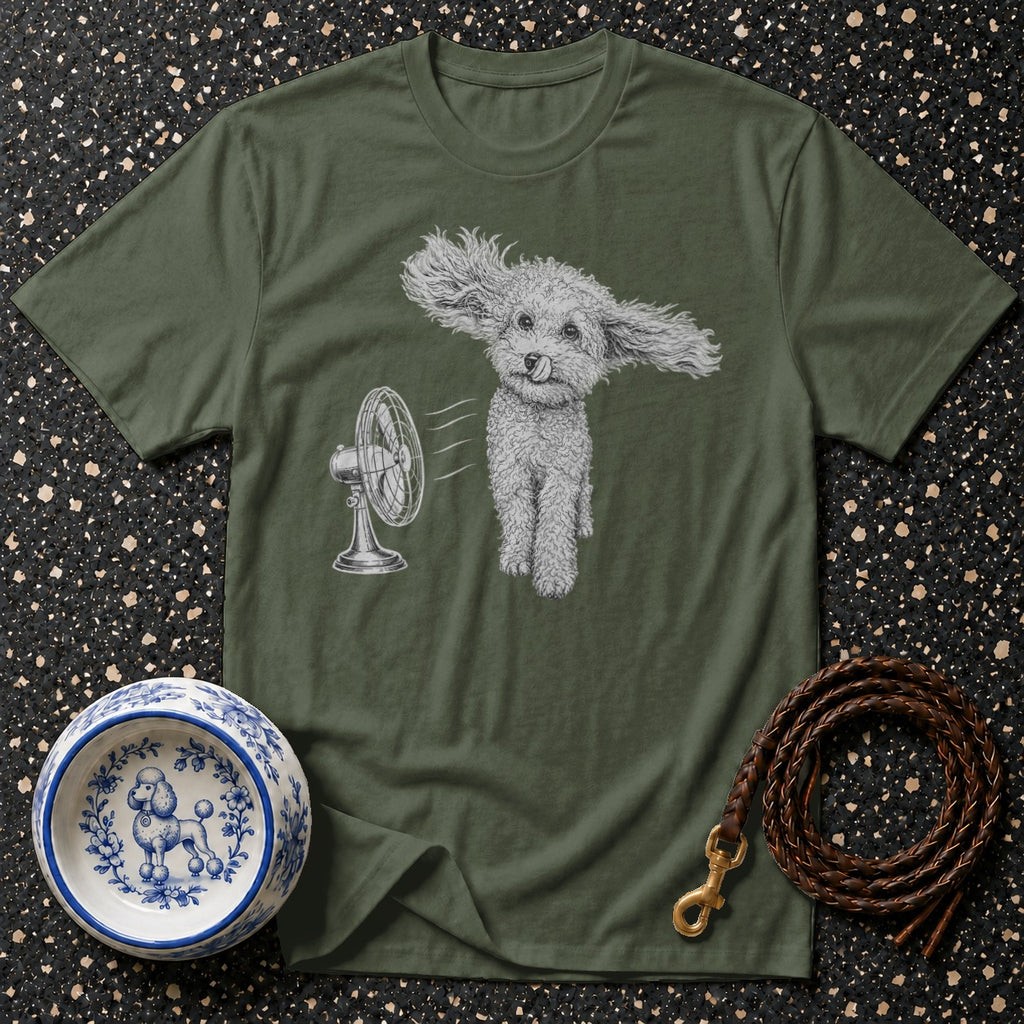 Green t-shirt with a drawing of a poodle with its ears blowing in the wind from a fan.