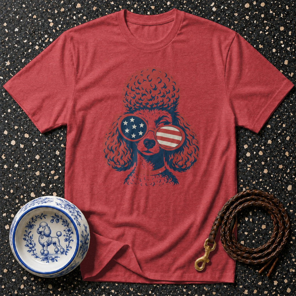 Red t-shirt with poodle wearing American flag sunglasses, dog bowl, and leash.