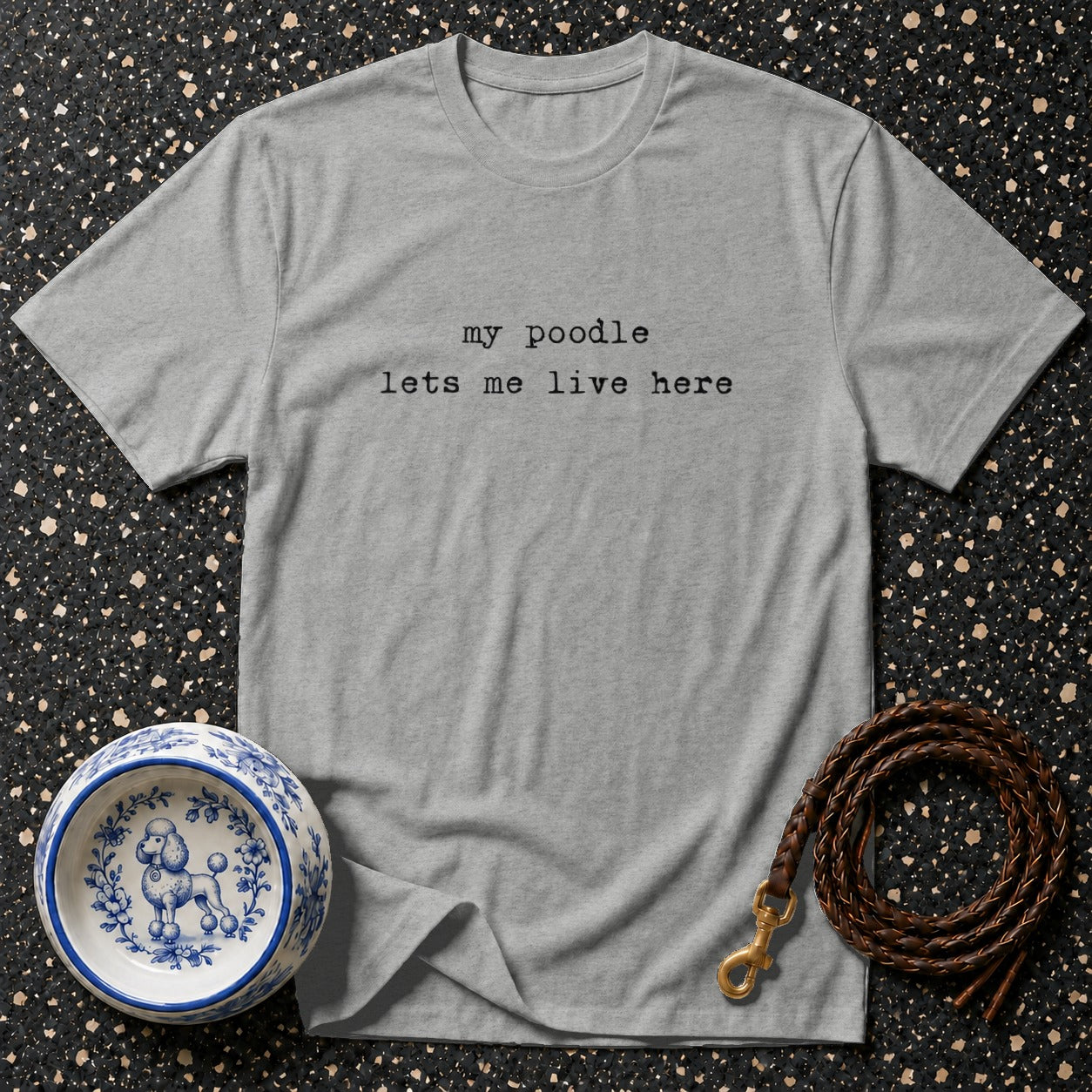 Grey t-shirt with "my poodle lets me live here" text, dog bowl, and leash.