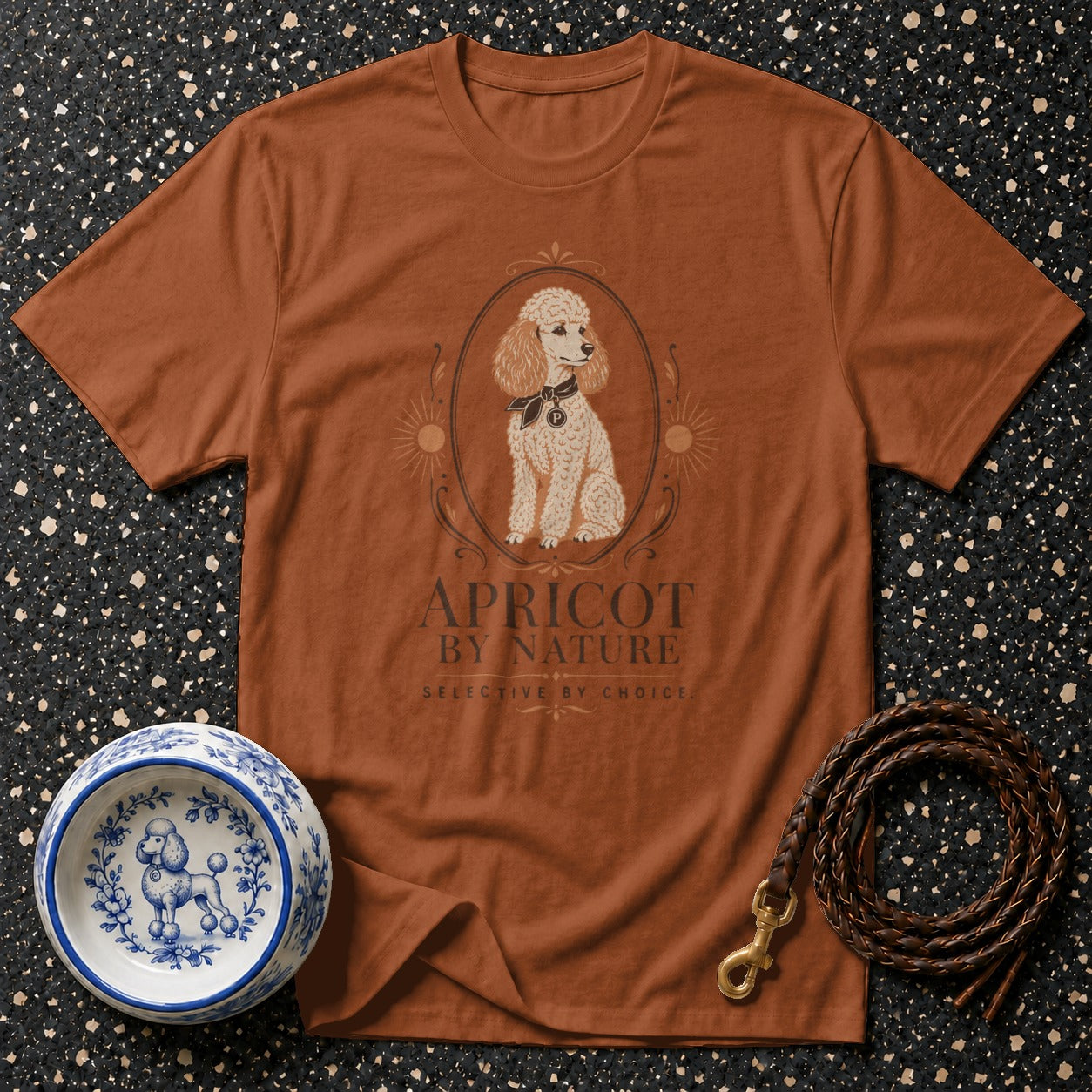 Apricot By Nature t-shirt with poodle graphic and accompanying dog bowl and leash.