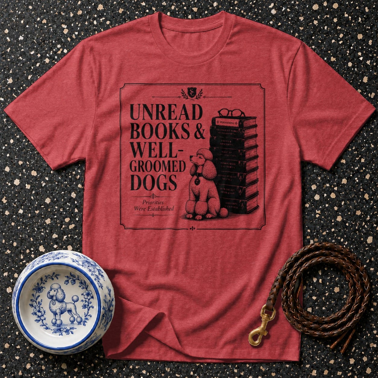 Red t-shirt with text "Unread Books & Well-Groomed Dogs" and a poodle.