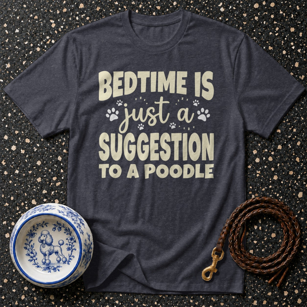 Dark gray t-shirt with cream text reading "BEDTIME IS JUST A SUGGESTION TO A POODLE".