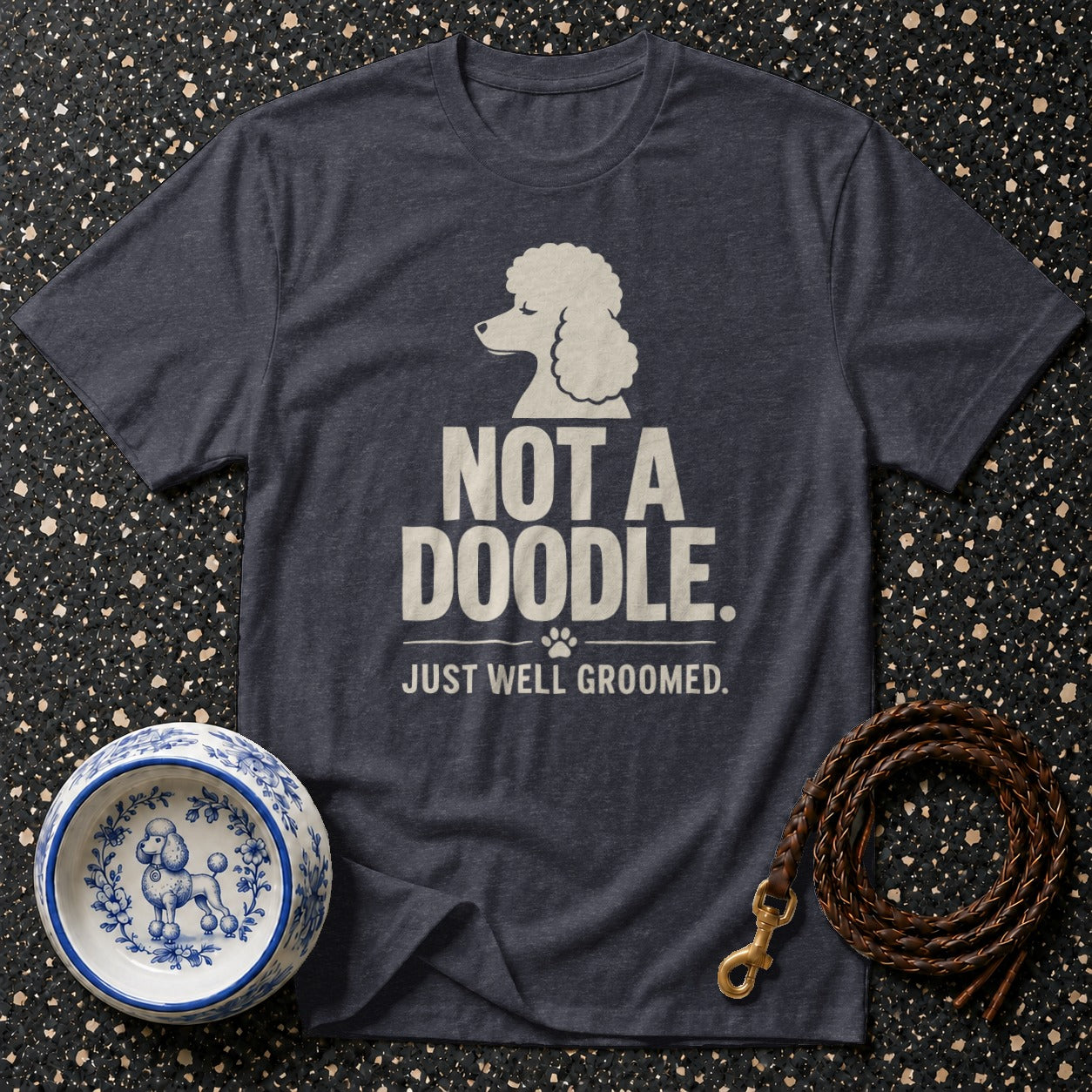 Dark grey t-shirt with poodle graphic and text: "NOT A DOODLE. JUST WELL GROOMED."