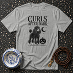 Grey t-shirt with black poodle, pumpkin, moon, and "Curls After Dark" text.
