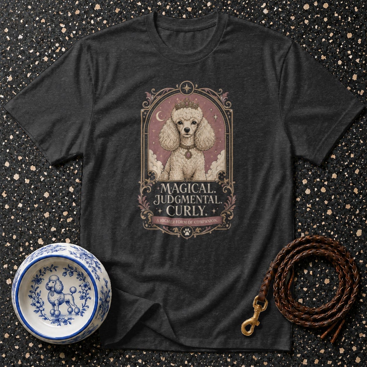 T-shirt with graphic of a crowned poodle and text "Magical. Judgmental. Curly."