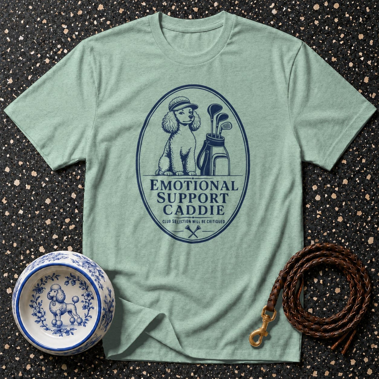 T-shirt with poodle wearing a cap and golf bag, text "Emotional Support Caddie".