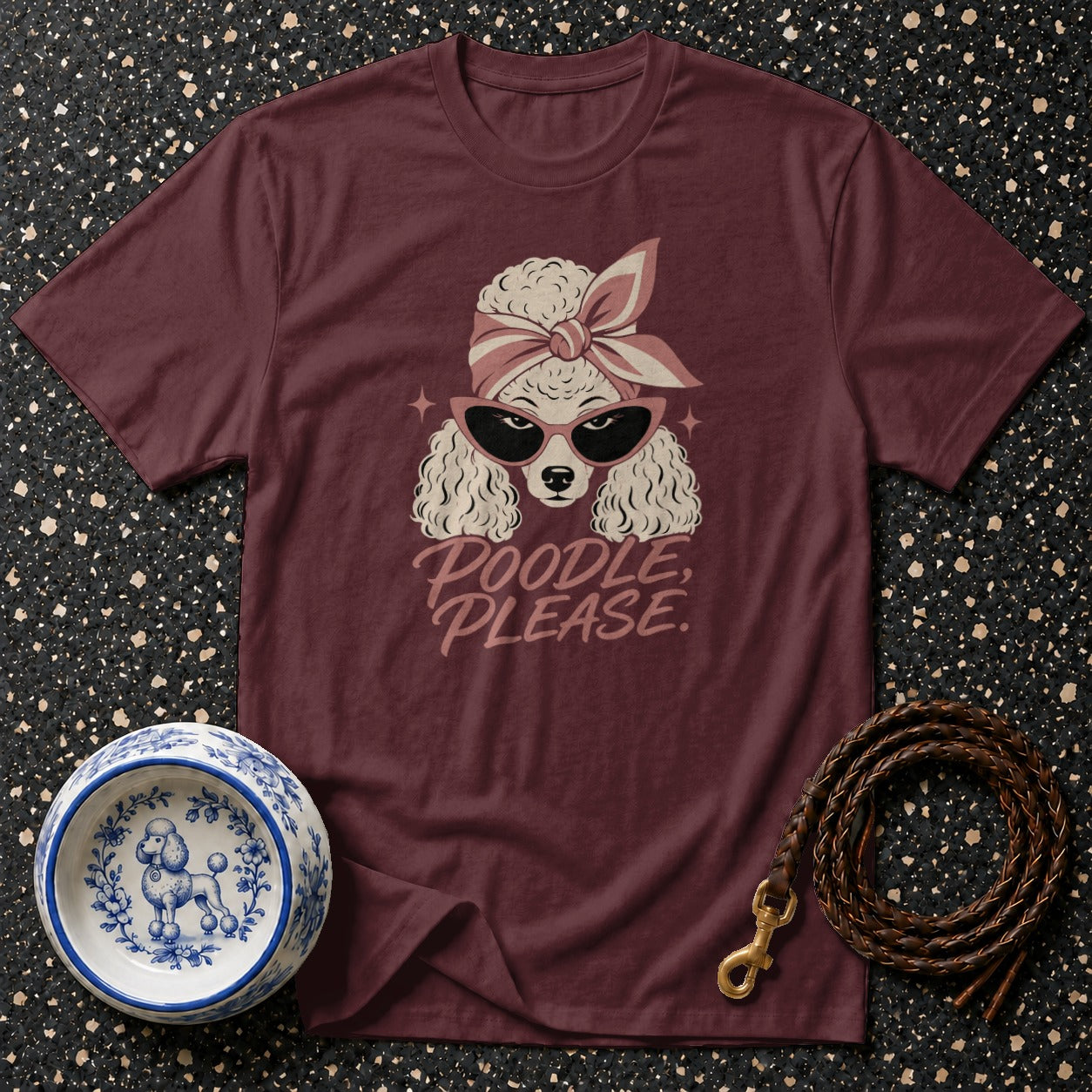 Maroon t-shirt with illustration of a poodle wearing sunglasses and bandana, text "Poodle, Please."