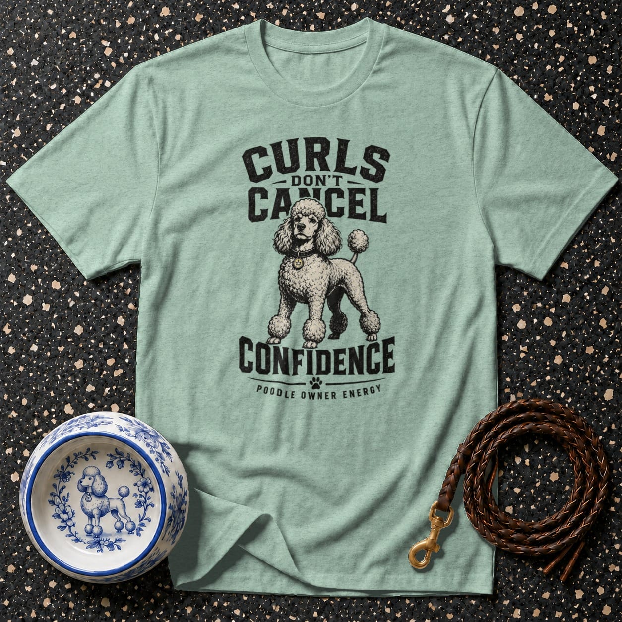 Light teal t-shirt with poodle graphic and text: "Curls Don't Cancel Confidence - Poodle Owner Energy".