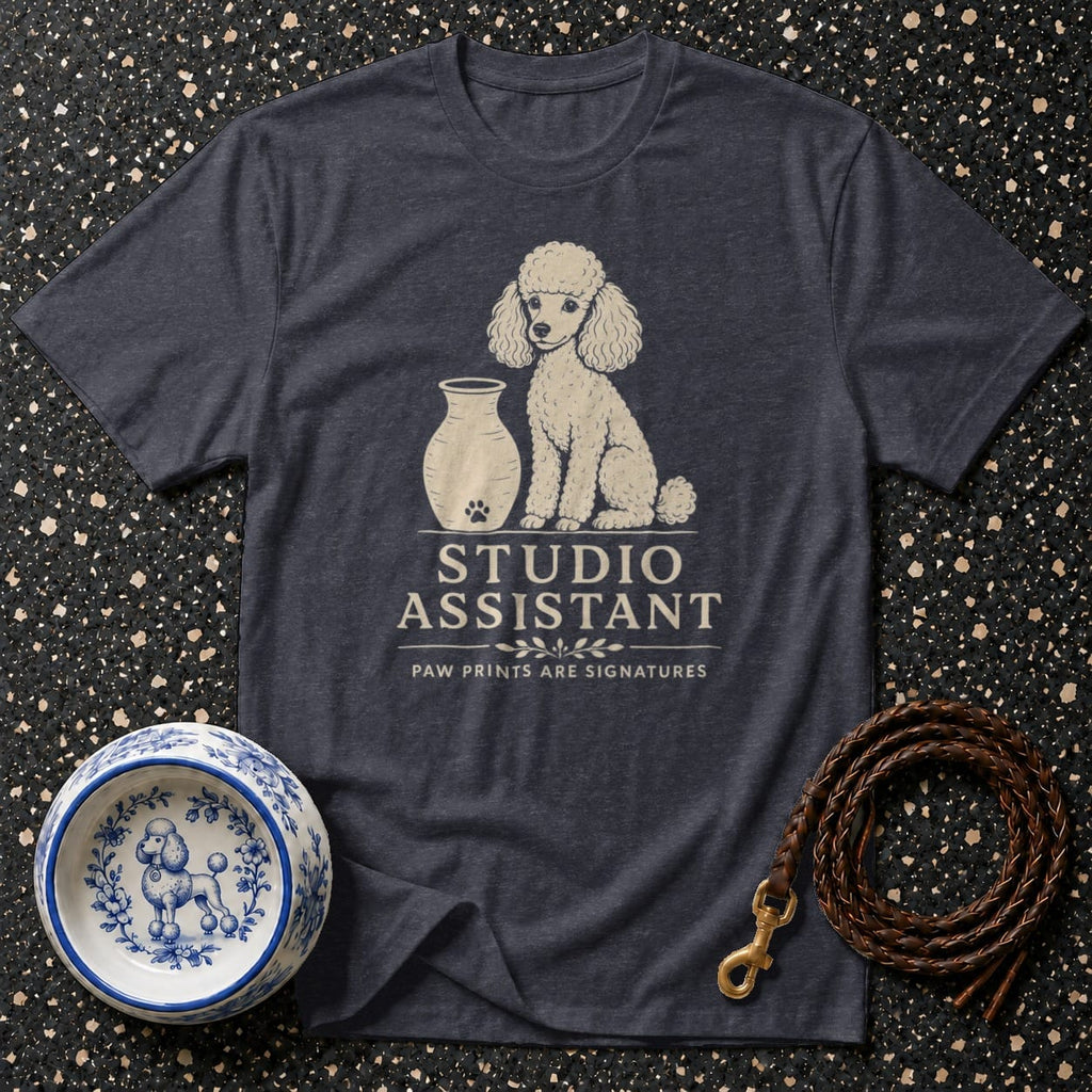 Dark t-shirt with a poodle graphic and "Studio Assistant" text.
