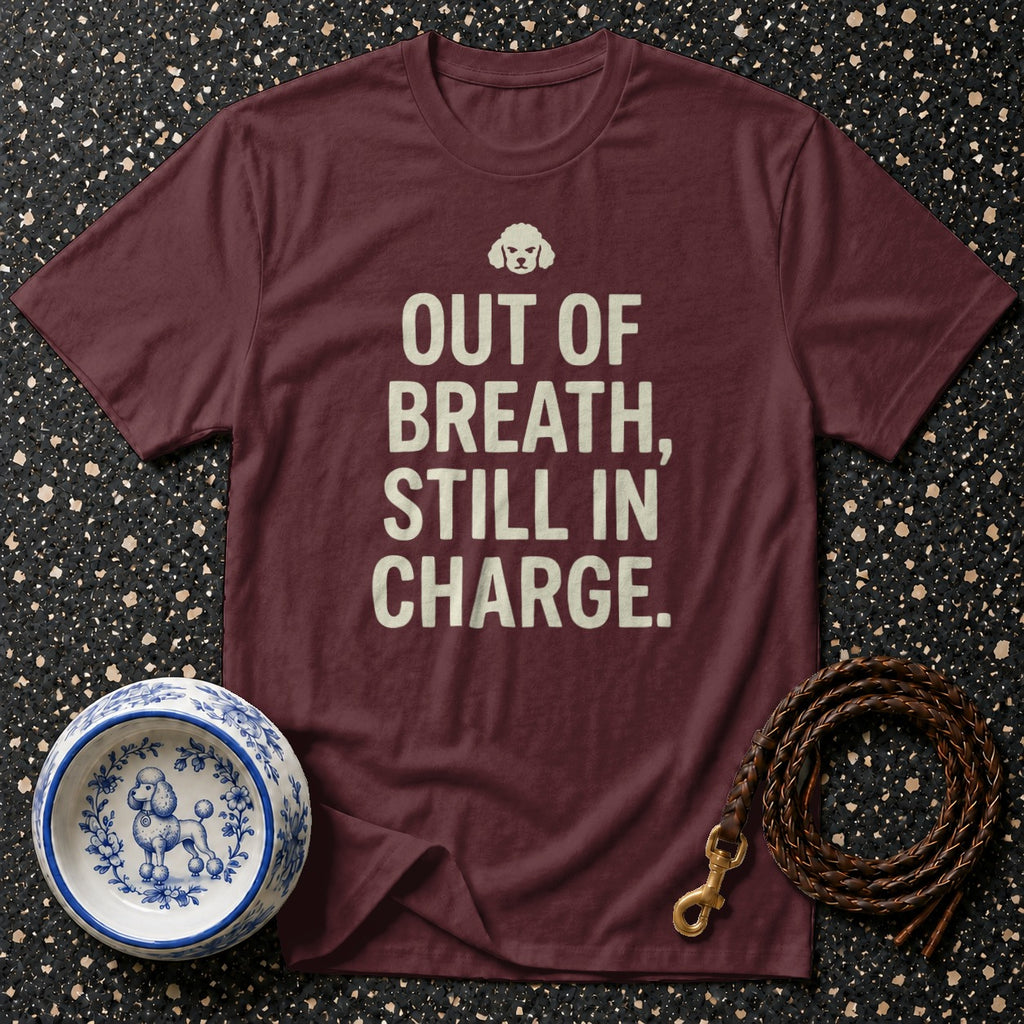 Maroon t-shirt with white text "OUT OF BREATH, STILL IN CHARGE" and a small dog graphic.