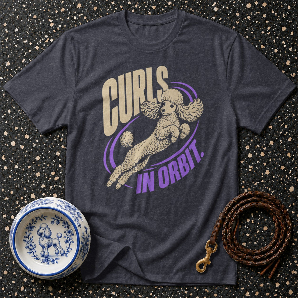 Dark gray t-shirt with graphic of poodle in orbit and text "Curls in Orbit."