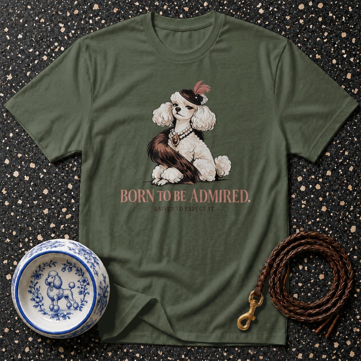 Green t-shirt with a poodle illustration and "BORN TO BE ADMIRED" text.