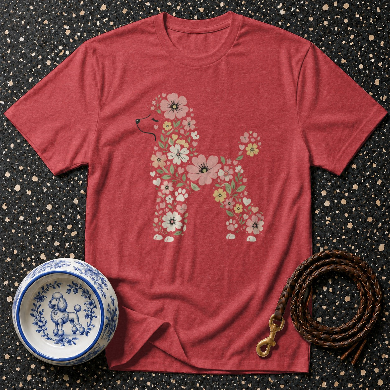 Red t-shirt with a floral poodle silhouette and accompanying dog bowl and leash.