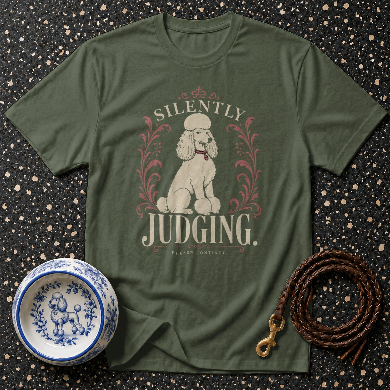 Green t-shirt with a poodle design and text "Silently Judging. Please Continue."