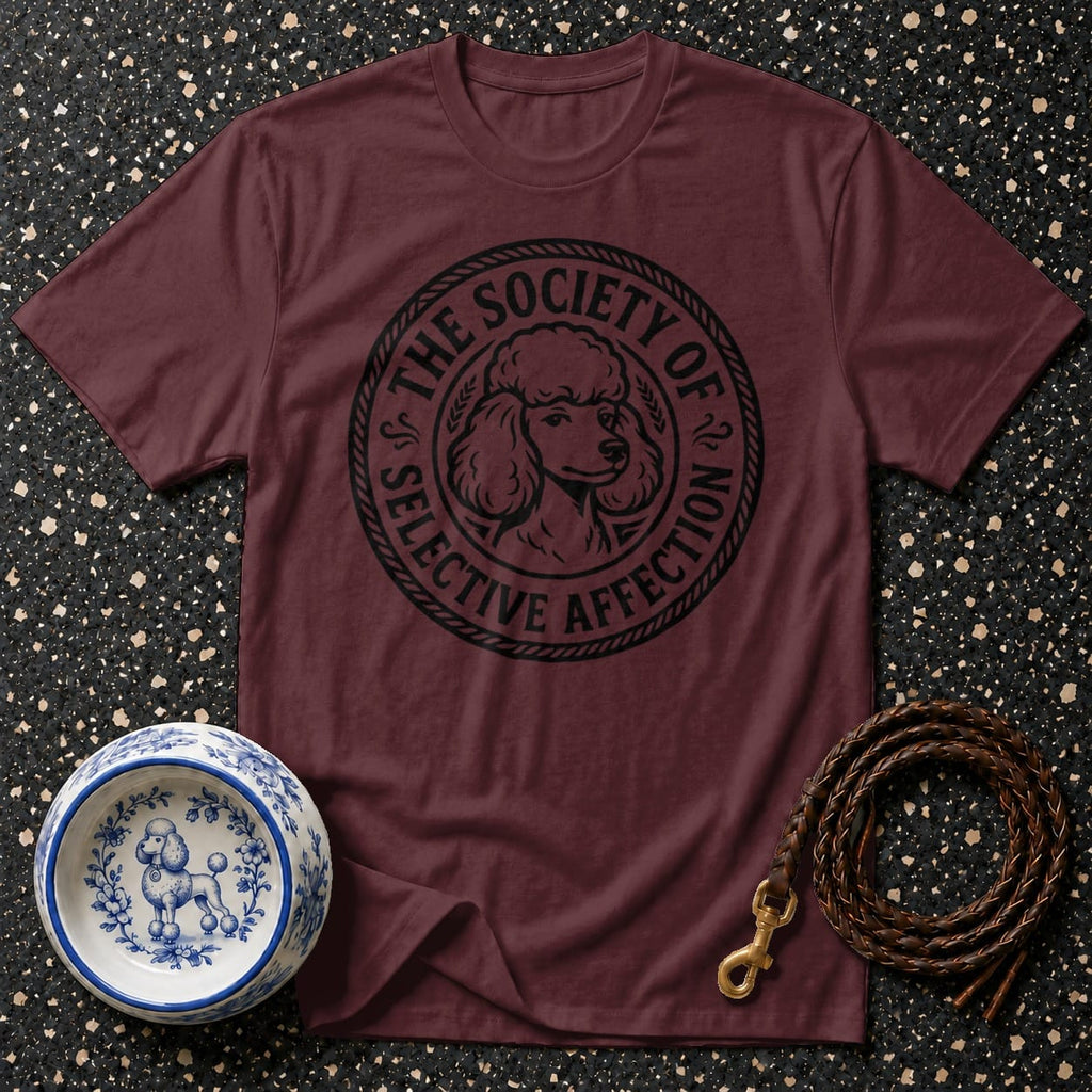 Maroon t-shirt with black poodle graphic and text saying "The Society of Selective Affection".