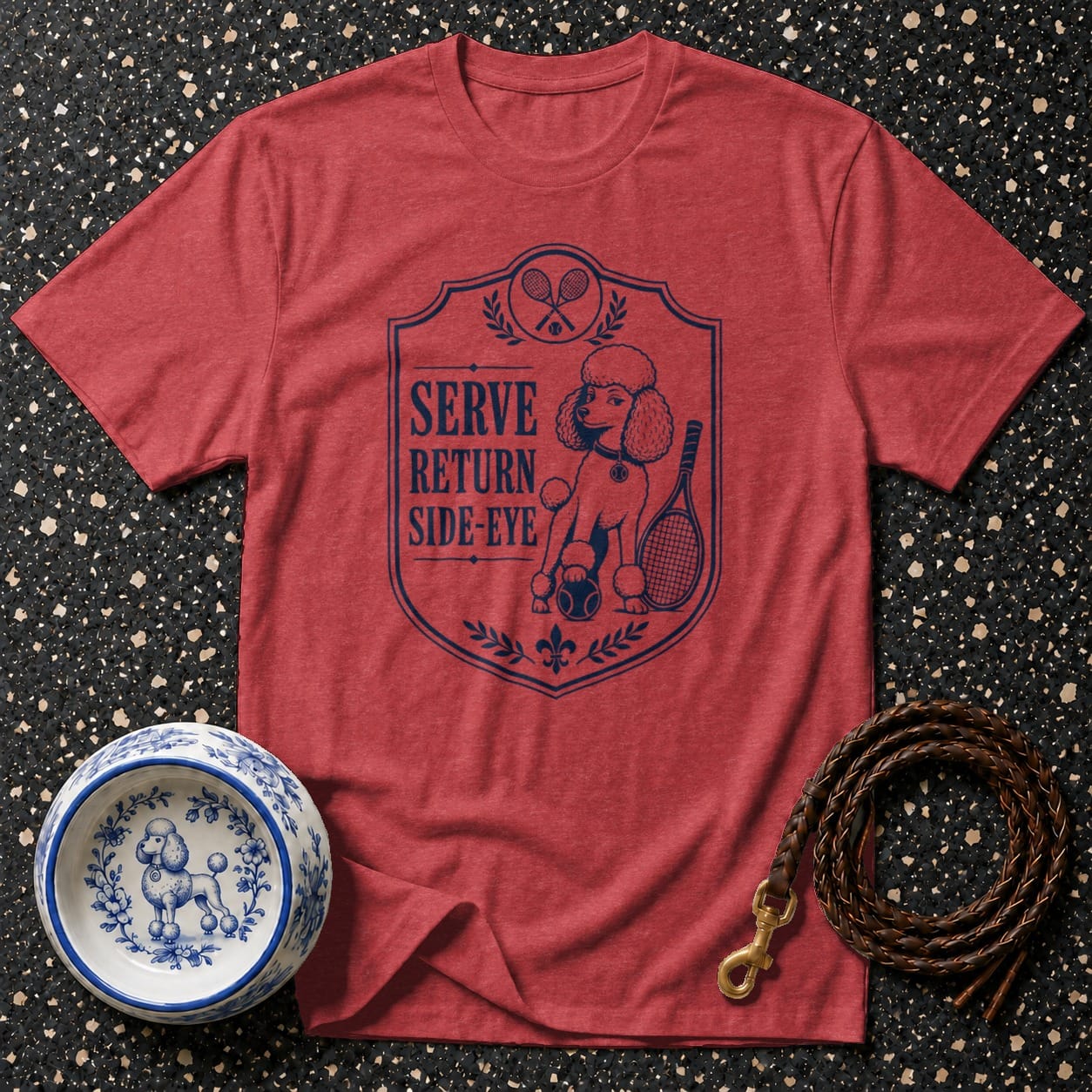 Red t-shirt with a shield graphic featuring a poodle playing tennis and the words Serve, Return, Side-Eye.