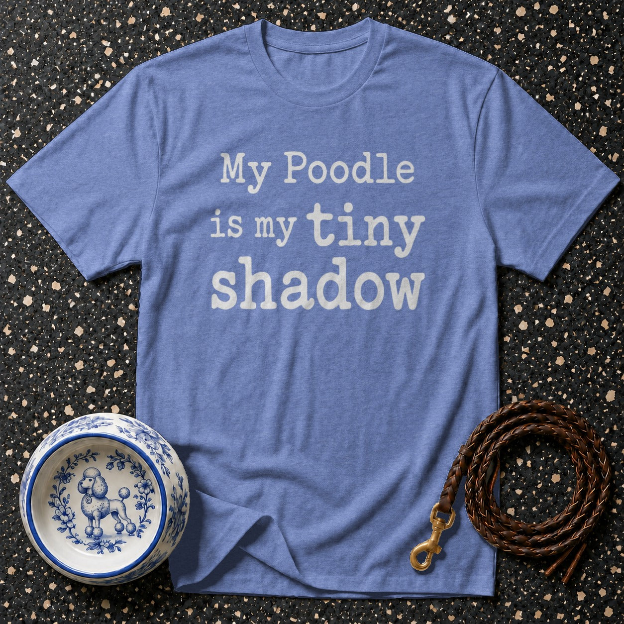 Blue t-shirt with "My Poodle is my tiny shadow" text, poodle bowl, and leash.