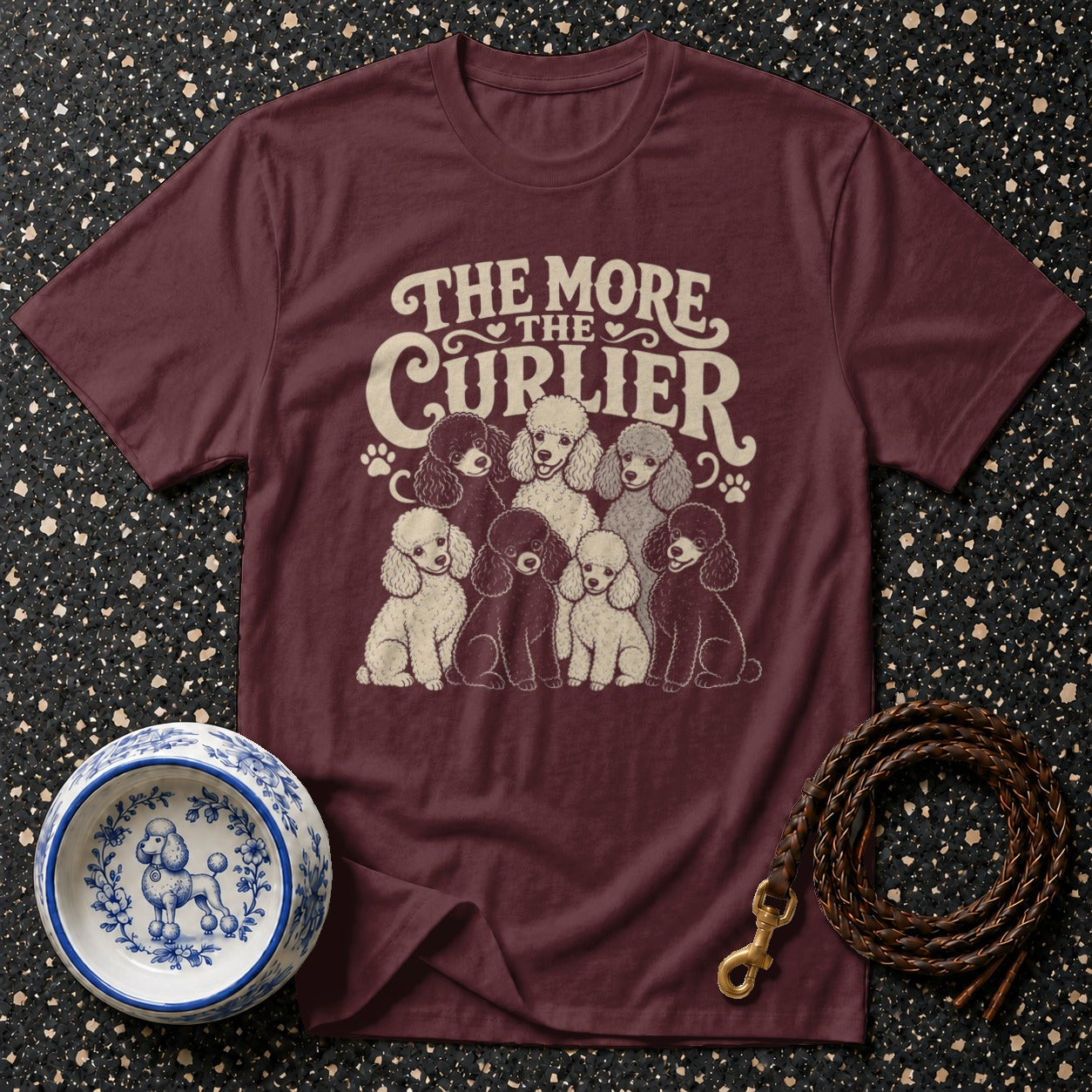 Maroon t-shirt with a graphic of poodles and the text "The More The Curlier".