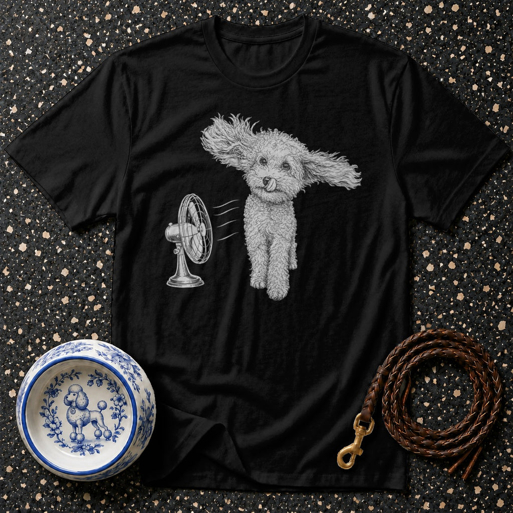 Black t-shirt with poodle in front of a fan and decorative dog bowl.