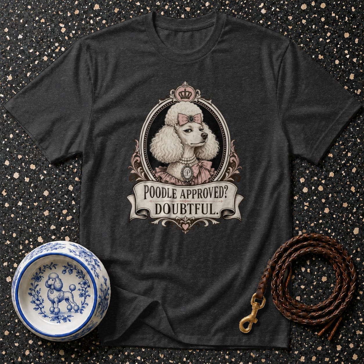 Dark t-shirt with a regal poodle illustration and text "POODLE APPROVED? DOUBTFUL."