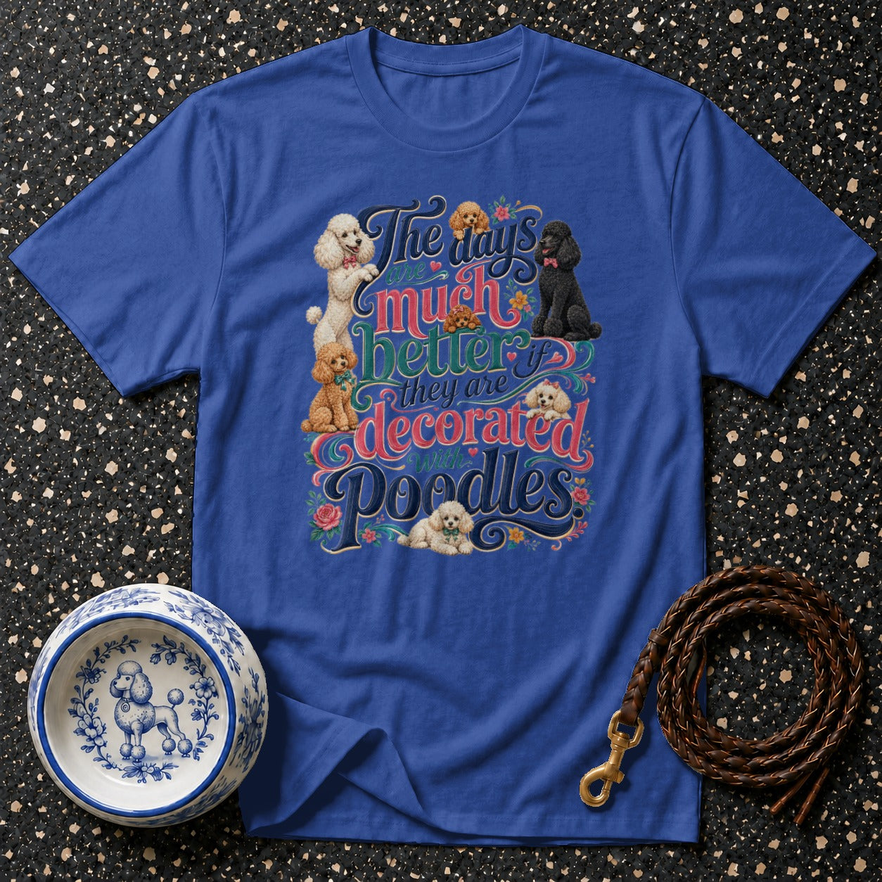Blue t-shirt with "The days are much better if they are decorated with Poodles" graphic.