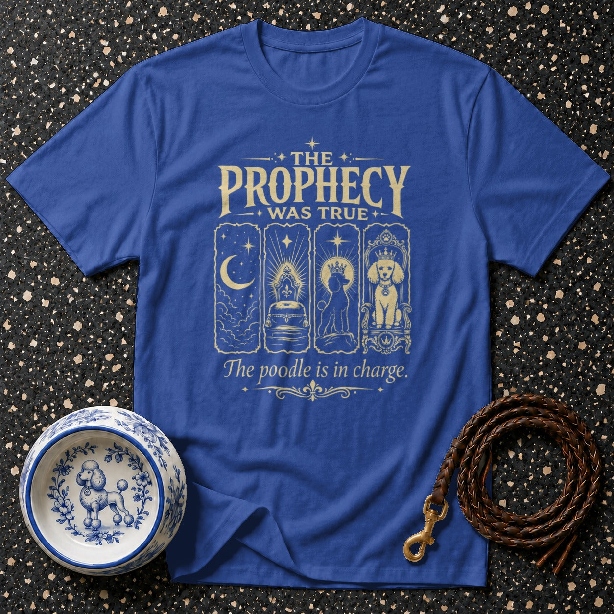 Blue t-shirt with gold text "The Prophecy Was True" and "The poodle is in charge."