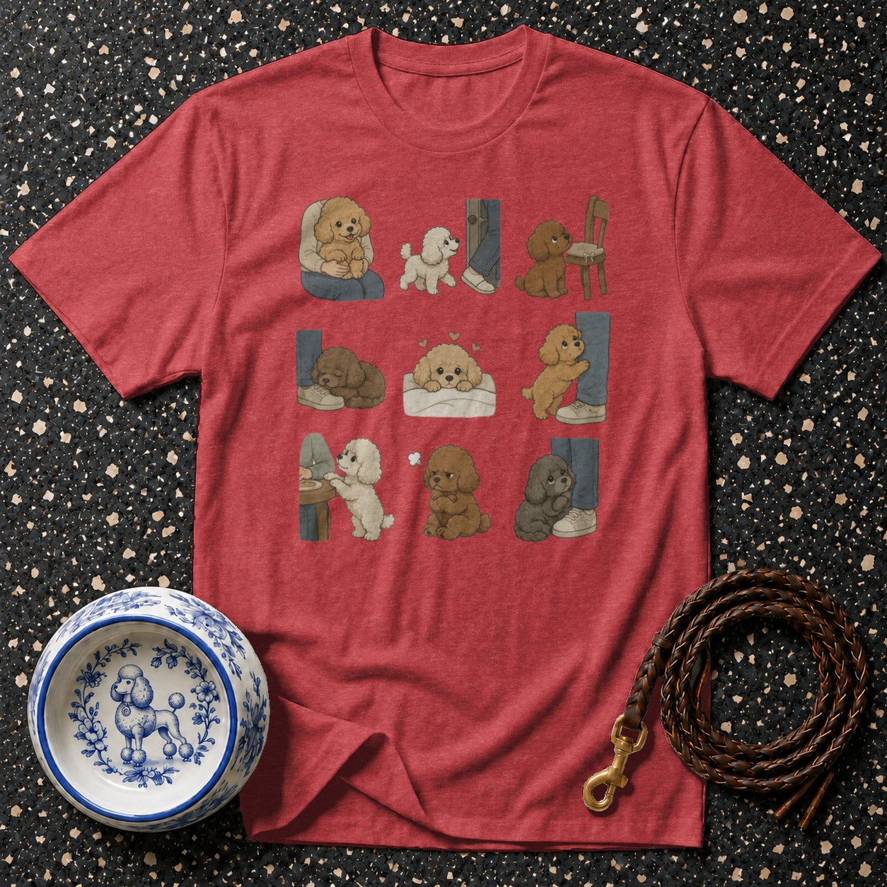 Crimson t-shirt with nine cartoon poodles in various poses and a dog leash and bowl.