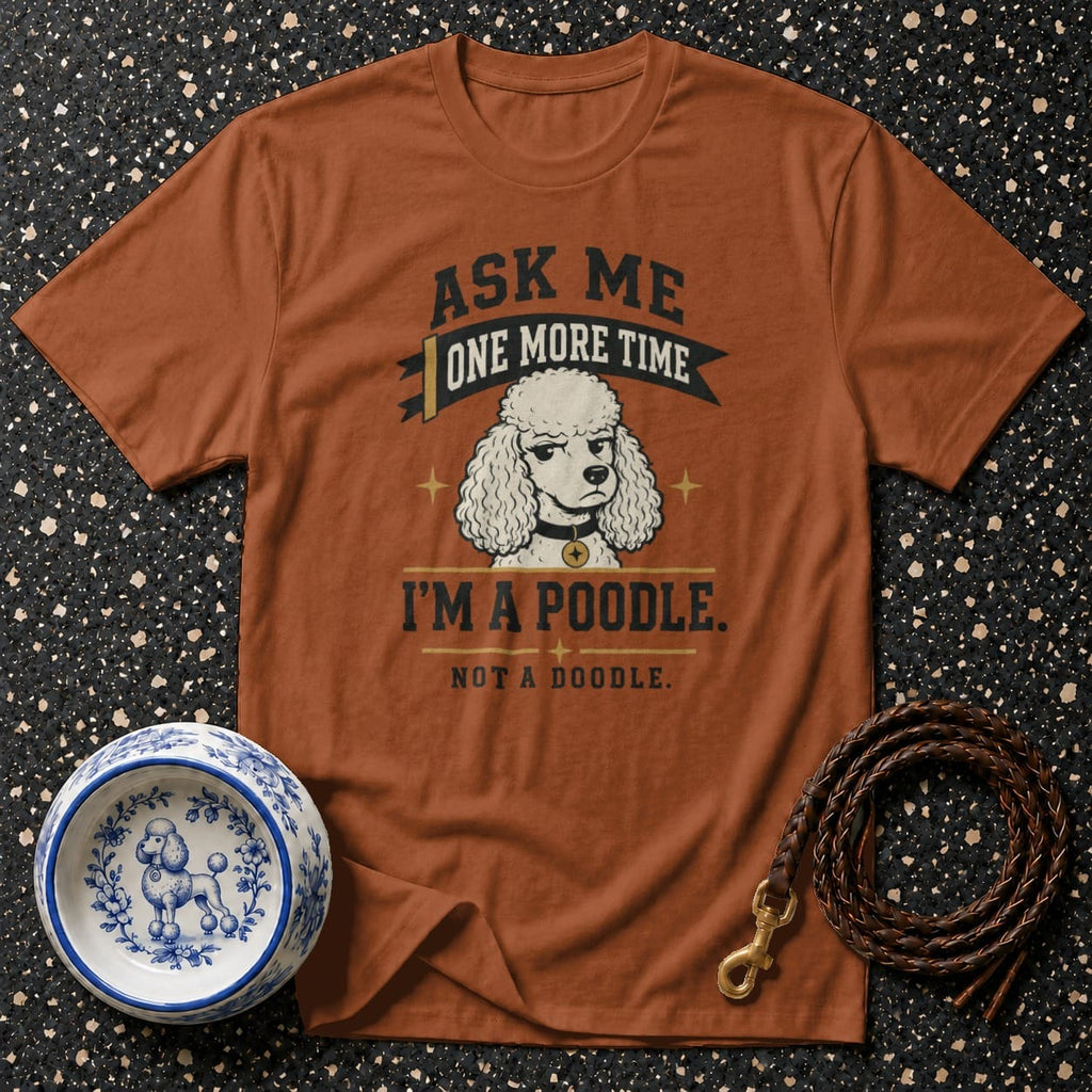 Brown t-shirt with text "Ask me one more time, I'm a poodle. Not a doodle." and poodle illustration.