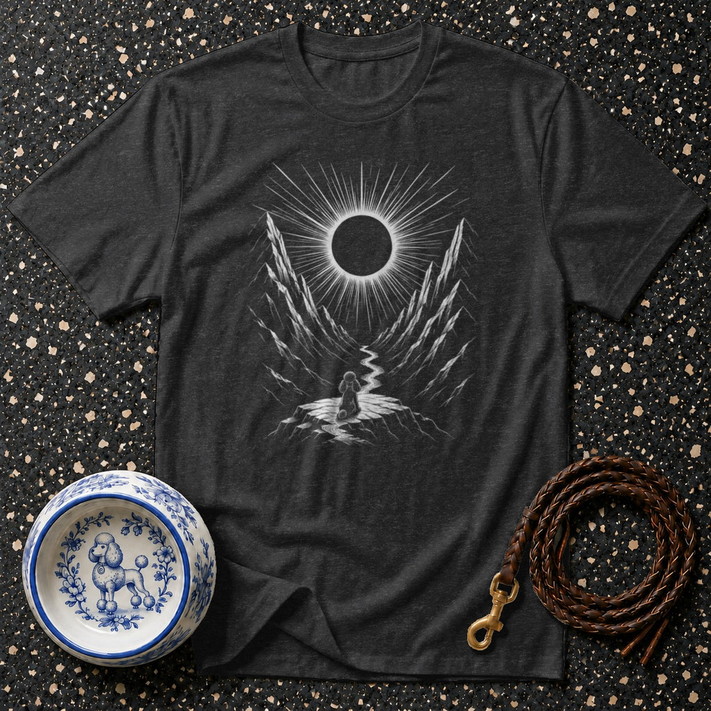 Dark gray t-shirt with a graphic of a person facing a solar eclipse in a mountain valley.