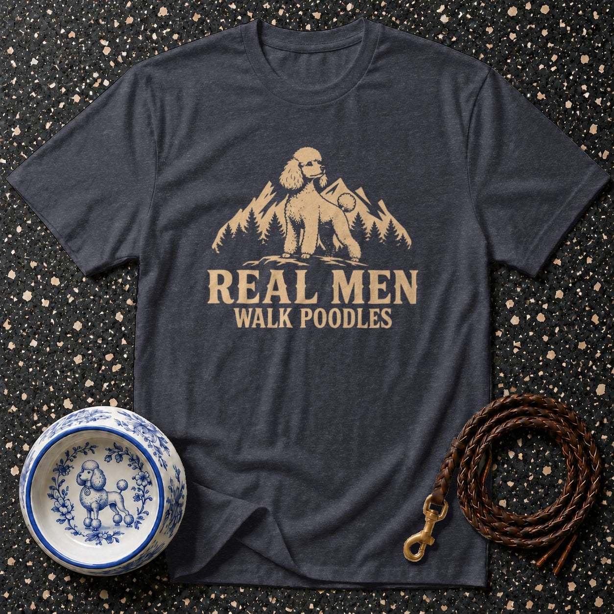 T-shirt with "Real Men Walk Poodles" text and a poodle on a mountain.