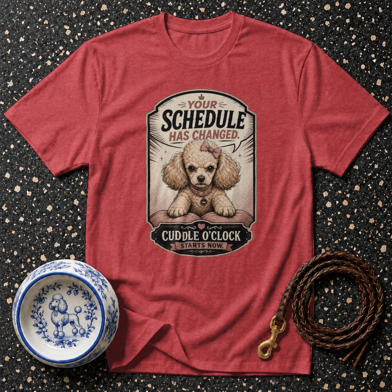 Red t-shirt featuring a poodle illustration with text "Your Schedule Has Changed. Cuddle o'clock starts now."