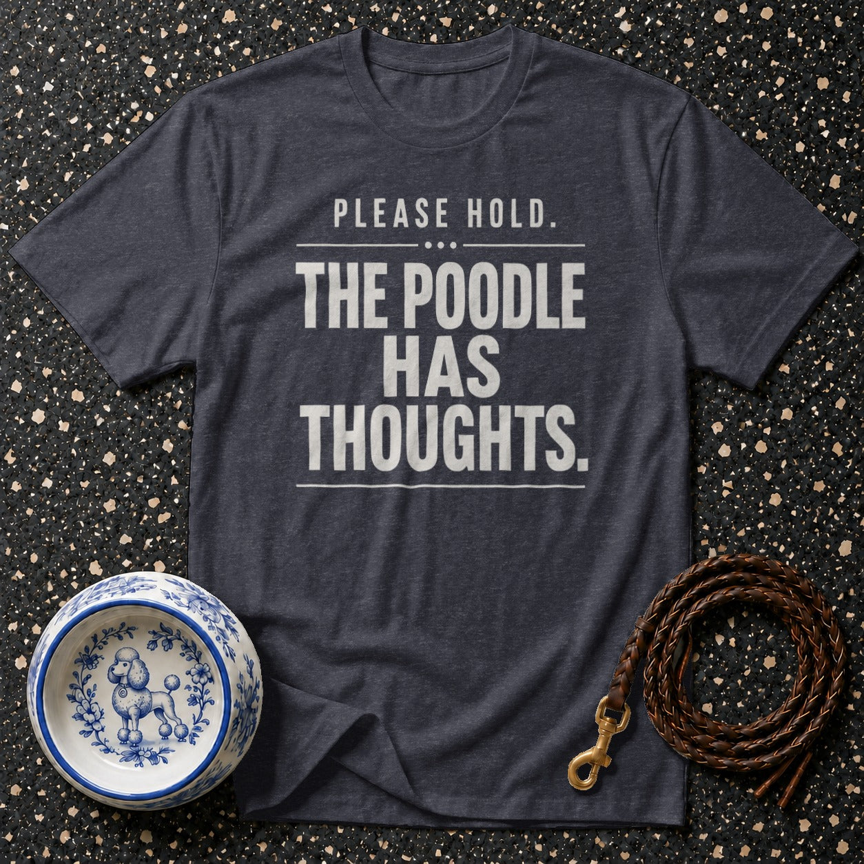 Dark grey t-shirt with white text "PLEASE HOLD. THE POODLE HAS THOUGHTS."