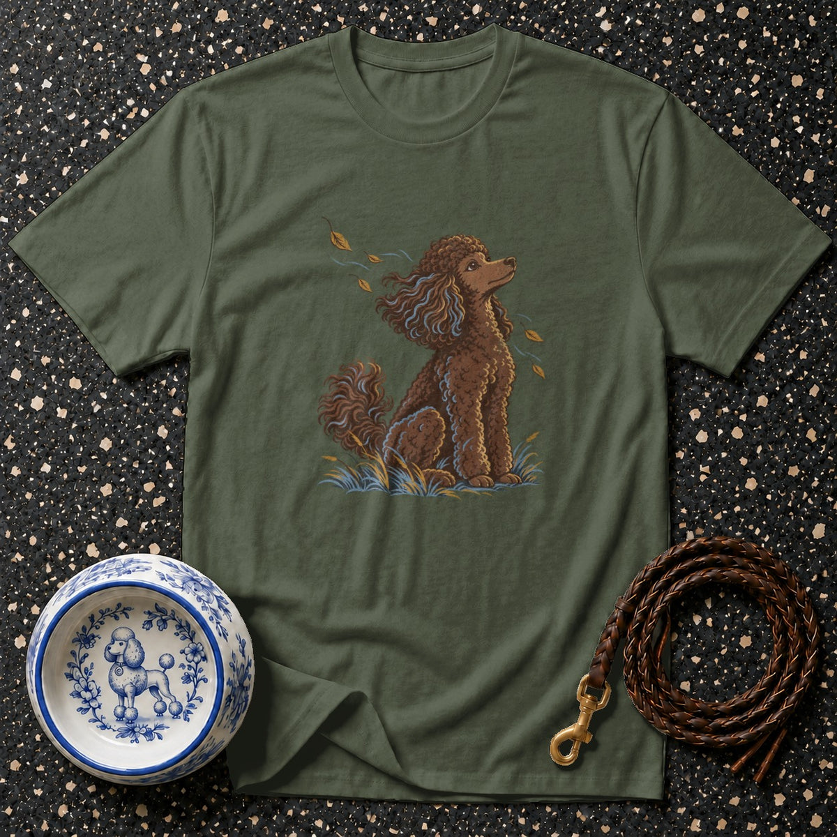Olive t-shirt with a brown poodle illustration, dog bowl, and braided leash.