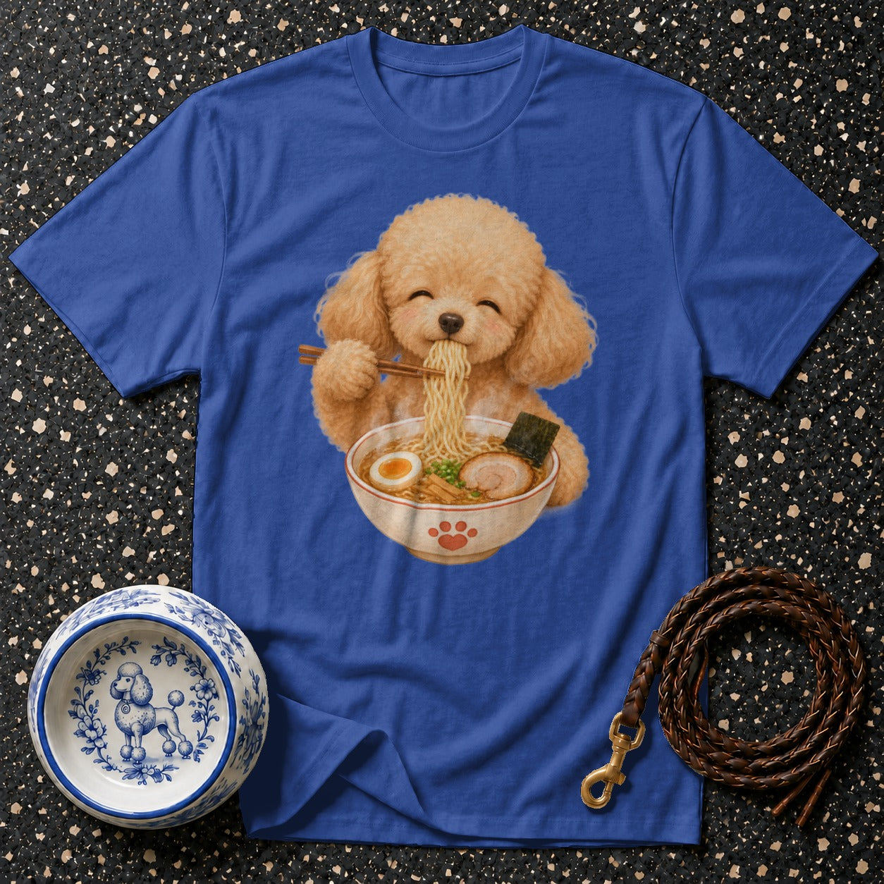 Blue t-shirt with illustration of a poodle eating ramen and a dog bowl.