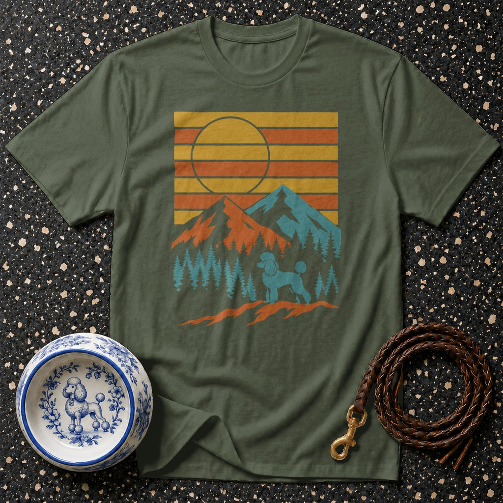 Olive green t-shirt with retro sunset, mountains, trees, and poodle graphic.