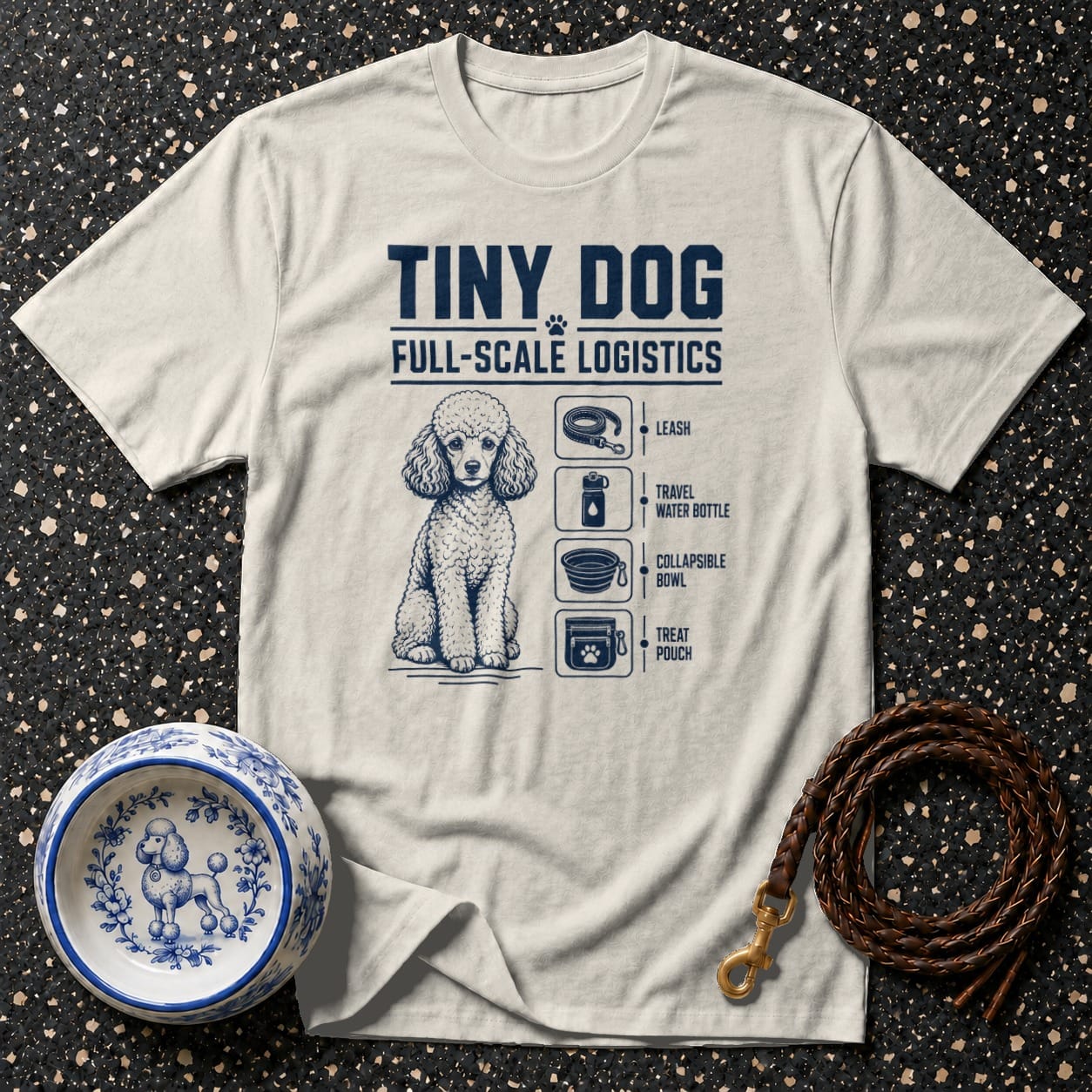 Beige t-shirt with a poodle and dog accessory list, "Tiny Dog Full-Scale Logistics".