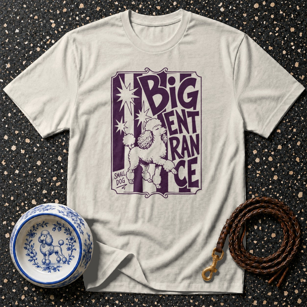 White t-shirt with purple graphic of a poodle and text "BIG ENTRANCE"