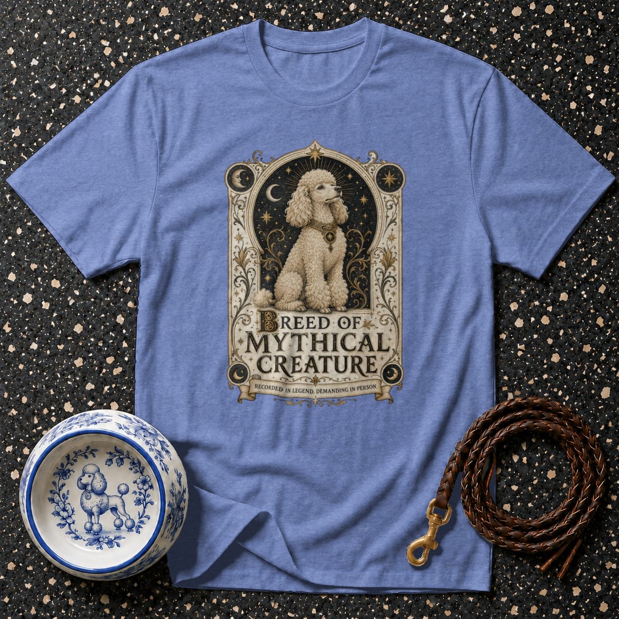 Blue t-shirt with poodle graphic and text "BREED OF MYTHICAL CREATURE".