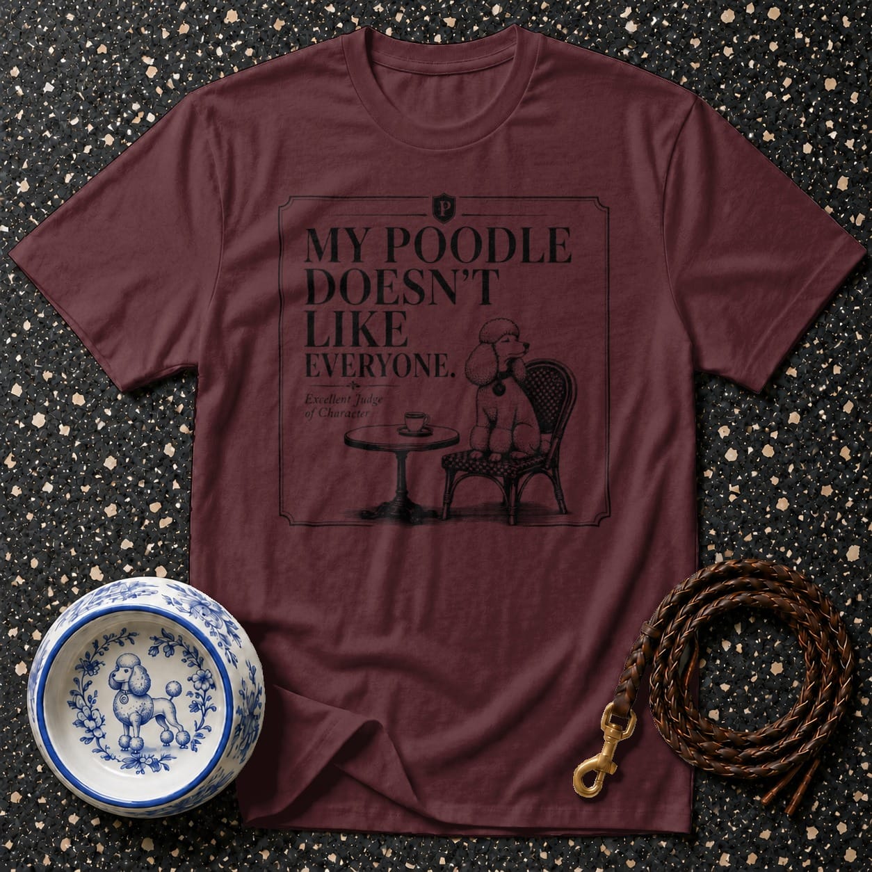 Maroon t-shirt with "My poodle doesn't like everyone" text and poodle illustration.