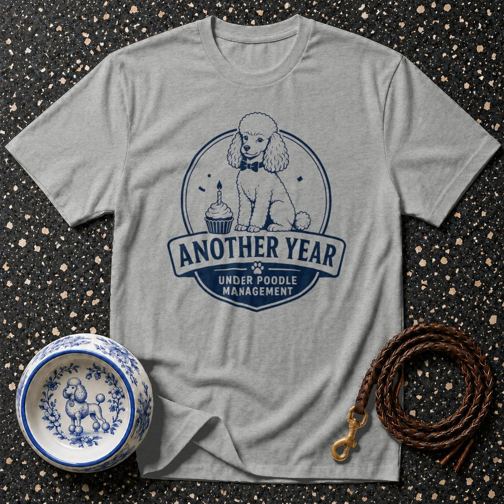 Grey t-shirt with navy poodle graphic and "Another Year Under Poodle Management" text.