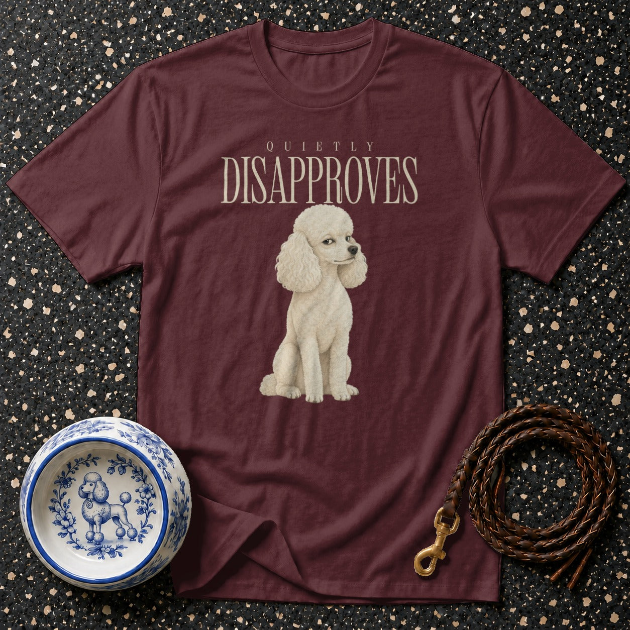 Maroon t-shirt with white poodle and "Quietly Disapproves" text.